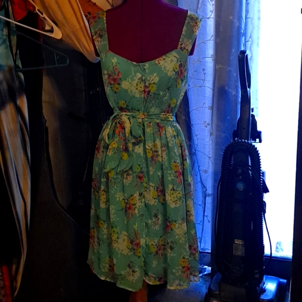 Adorable flowered summer dress. Teal with purple,yellow, and pink flowers.